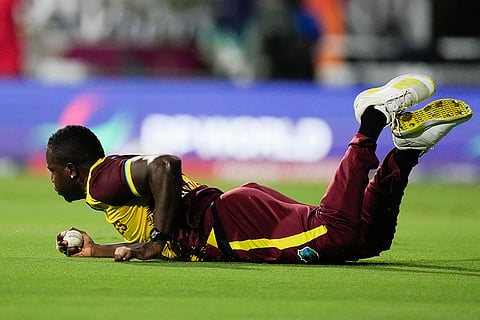 West Indies' Rovman Powell takes a catch